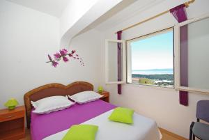 Postel nebo postele na pokoji v ubytování Apartments Senka