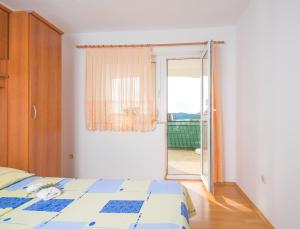 Postel nebo postele na pokoji v ubytování Apartments Cvita Sučić