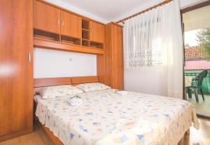 Postel nebo postele na pokoji v ubytování Apartments Cvita Sučić