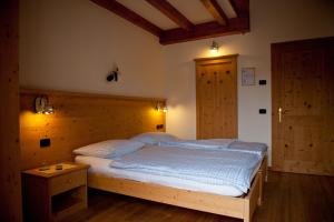 Posteľ alebo postele v izbe v ubytovaní Agritur Renetta