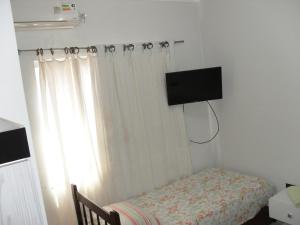 TV a/nebo společenská místnost v ubytování Hotel Niteroi