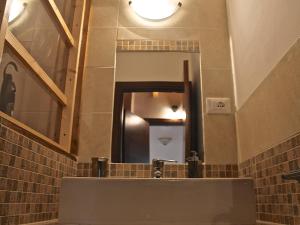 a bathroom with a sink and a mirror at B&B Kikina in Austis +38 photos