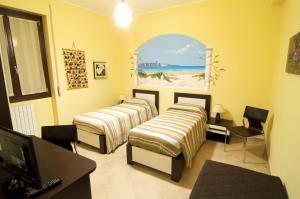 Postel nebo postele na pokoji v ubytování B&B La Porta Accanto