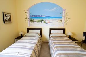 Postel nebo postele na pokoji v ubytování B&B La Porta Accanto