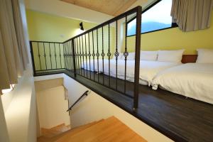Postel nebo postele na pokoji v ubytování Taroko Mountain View B&B