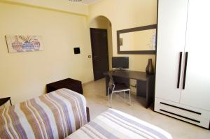 Postel nebo postele na pokoji v ubytování B&B La Porta Accanto