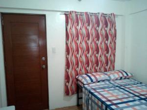 Letto o letti in una camera di Budget Studio Unit in Makati