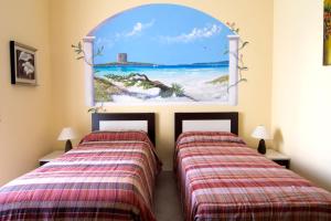 Postel nebo postele na pokoji v ubytování B&B La Porta Accanto