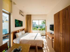 Postel nebo postele na pokoji v ubytování Babylon Garden Da Nang