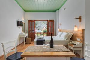 Televízia a/alebo spoločenská miestnosť v ubytovaní Asymi Residences