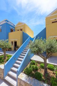 a blue stairway in front of a house at Asymi Residences in Symi