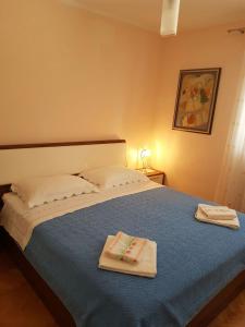 Posteľ alebo postele v izbe v ubytovaní 2B Apartment