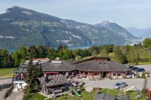 an aerial view of a building with mountains in the background at Chemihütte in Aeschi