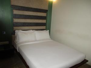 Postel nebo postele na pokoji v ubytování Hotel Sapna