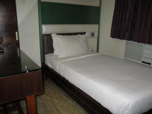 Postel nebo postele na pokoji v ubytování Hotel Sapna