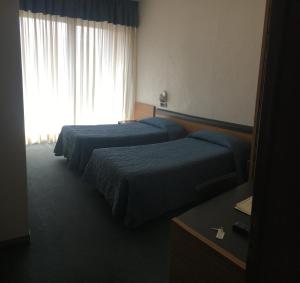 Postel nebo postele na pokoji v ubytování Albergo Valle d'Oro