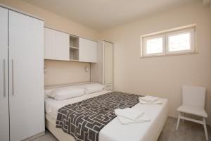 Кровать или кровати в номере Luxury Apartments Luka & Marko