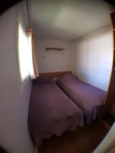 Postel nebo postele na pokoji v ubytování Camping la Chicanette