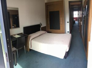 Postel nebo postele na pokoji v ubytování Albergo Valle d'Oro