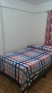Letto o letti in una camera di Budget Studio Unit in Makati