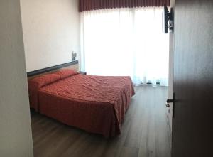 Postel nebo postele na pokoji v ubytování Albergo Valle d'Oro
