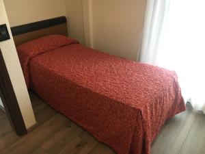 Postel nebo postele na pokoji v ubytování Albergo Valle d'Oro
