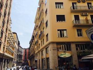 a street with tall buildings in a city at I 4 Elementi in Naples