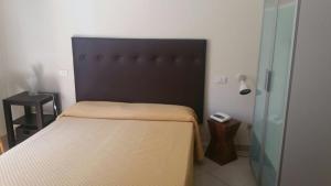 Postel nebo postele na pokoji v ubytování Hotel ILLI