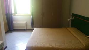 Postel nebo postele na pokoji v ubytování Hotel ILLI