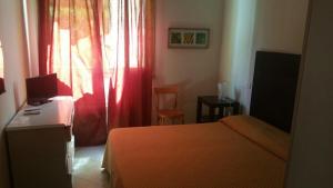 Postel nebo postele na pokoji v ubytování Hotel ILLI