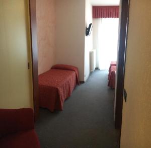 Postel nebo postele na pokoji v ubytování Albergo Valle d'Oro