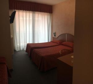 Postel nebo postele na pokoji v ubytování Albergo Valle d'Oro