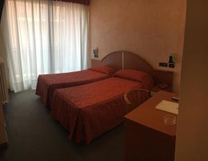 Postel nebo postele na pokoji v ubytování Albergo Valle d'Oro