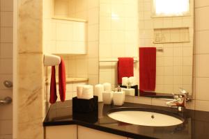 a bathroom with a sink and a mirror at Millhousedune in Cepães +20 photos