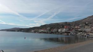 a view of a lake with houses and buildings at LARA & VITO in Metajna