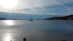 a boat in the middle of a large body of water at LARA & VITO in Metajna