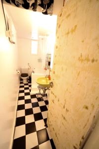 a bathroom with a black and white checkered floor at Sun sto Spiti in Athens
