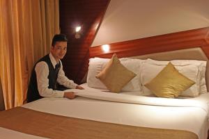 Ένα ή περισσότερα κρεβάτια σε δωμάτιο στο Dragonfly Hotel - The Art Hotel