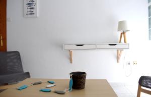 a table with some tools on it in a room at El Jardin BeNerja in Nerja