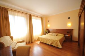 Posteľ alebo postele v izbe v ubytovaní Hotel Panoramic Montepulciano