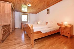 Postel nebo postele na pokoji v ubytování Haus Brügga