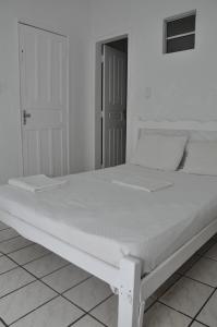 Ένα ή περισσότερα κρεβάτια σε δωμάτιο στο Hospedagem São Francisco