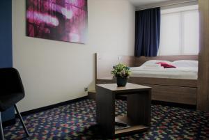 Postel nebo postele na pokoji v ubytování Kongres Hotel Roca