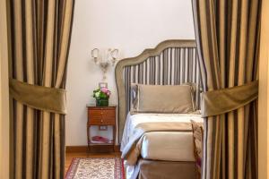 Letto o letti in una camera di Hotel Forum