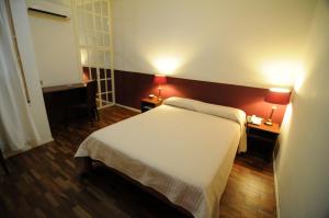 Cama o camas de una habitación en Gran Hotel Uruguay