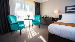 Uma cama ou camas num quarto em Hotel Kilmore
