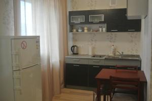 Kuchyň nebo kuchyňský kout v ubytování Piramida Apartments