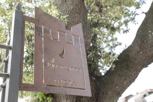 a sign in front of a tree at Al Tartarughino B&B in Cercola