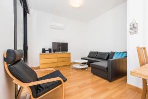 Televízia a/alebo spoločenská miestnosť v ubytovaní Jinetes Penthouse in Malaga by Solaga Holiday Homes