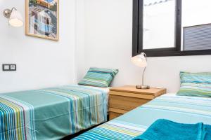 Posteľ alebo postele v izbe v ubytovaní Jinetes Penthouse in Malaga by Solaga Holiday Homes
